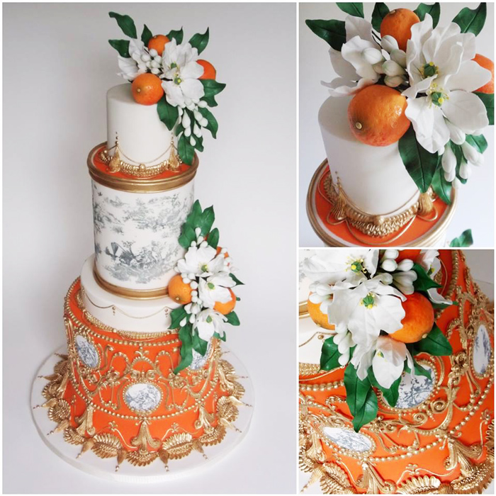 orange with white tiered cake